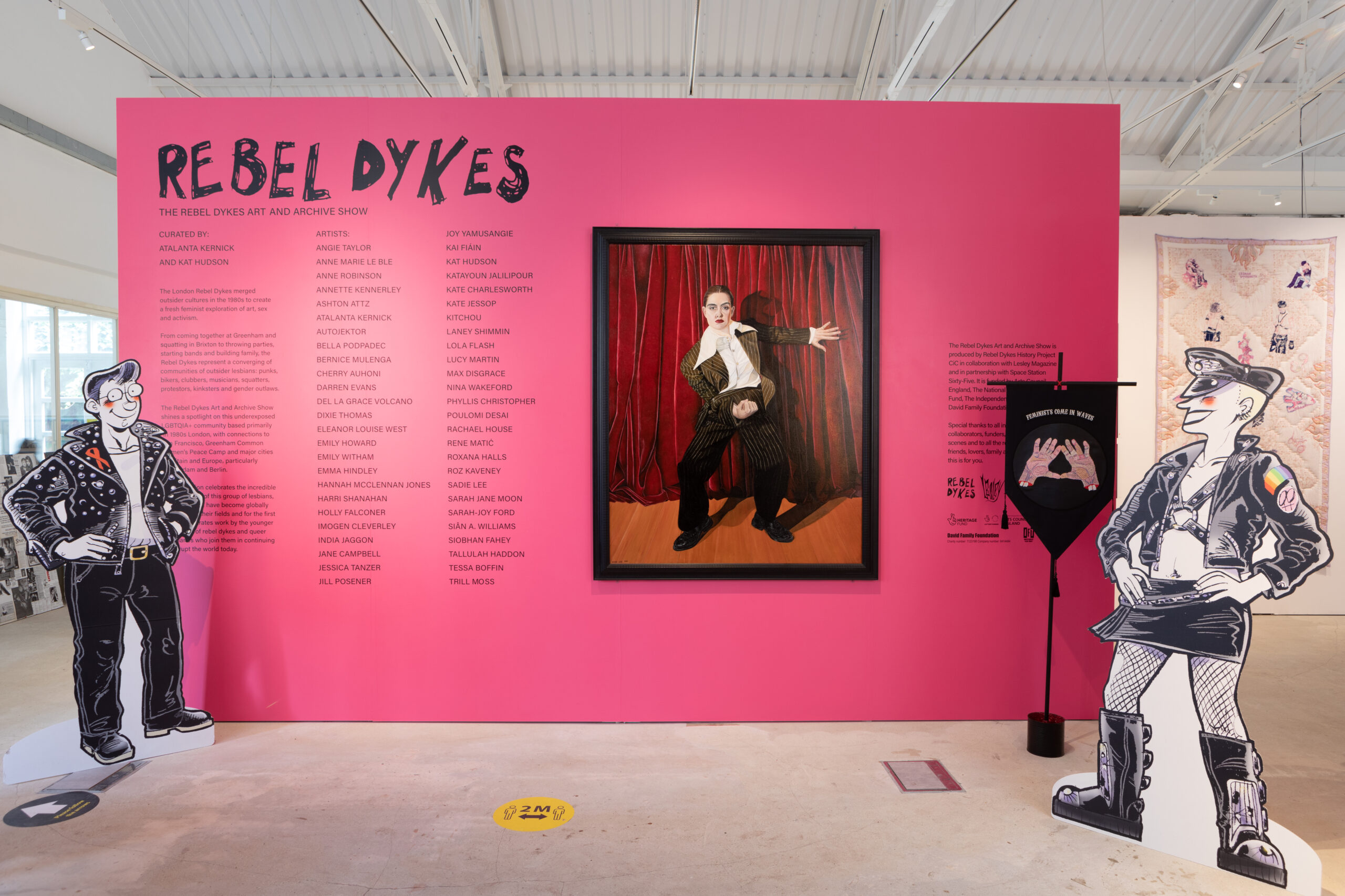 The Rebel Dykes Art & Archive Show exhibition entrance ft. works by Sadie Lee, Kate Charlesworth, Rachael House