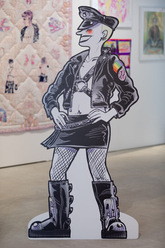 Rebel Dykes - Kate Charlesworth - Babydyke Leathergirl Cut-out, 2006 (with works by Sarah-Joy Ford, Bella Podpadec, Kat Hudson behind)