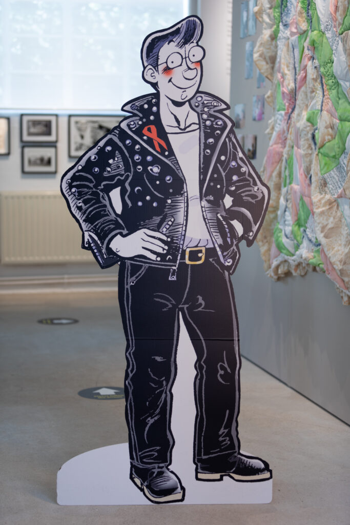 Rebel Dykes - Kate Charlesworth - Auntie Studs Cut-Out, 2006 (with works by Jill Posener, Eleanor Louise West behind)