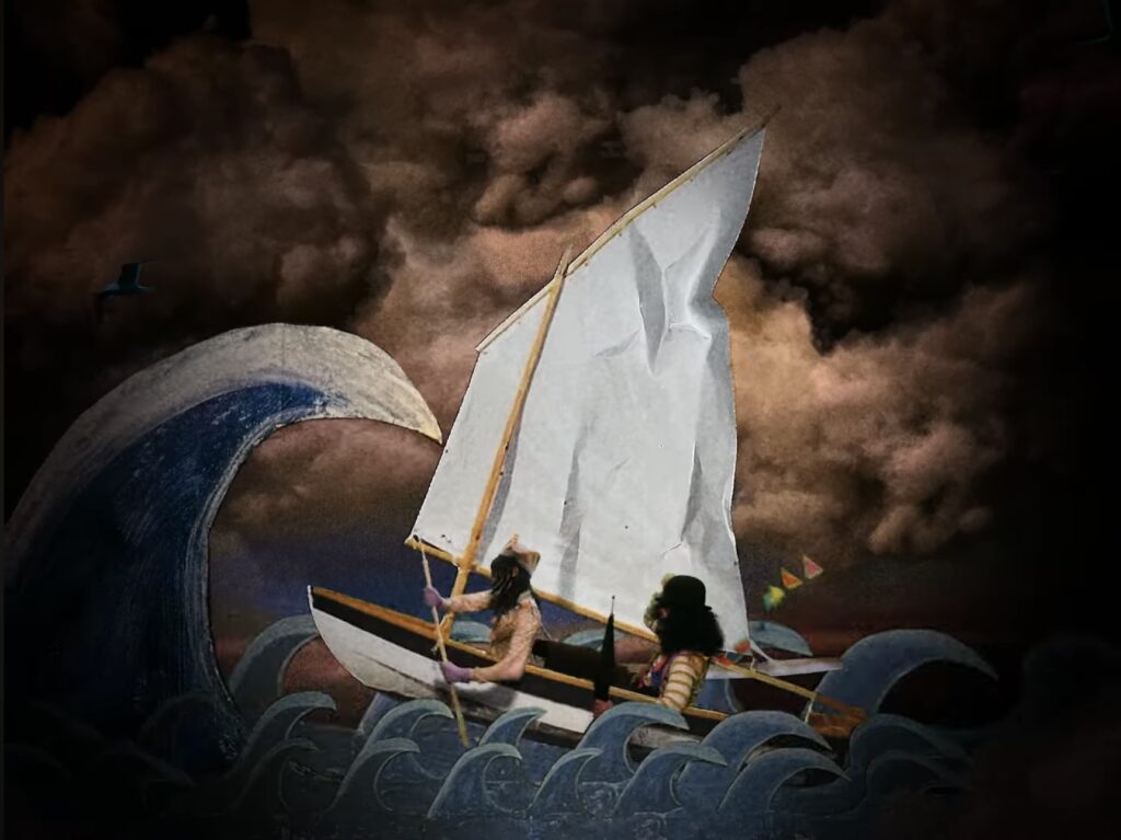 Still from sail boat scene featuring Kat Hudson, cardboard painted waves inspired by Derek Jarman, set piece for NiCKY music video, London 2023
